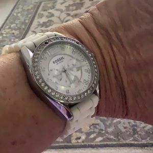 Fossil watch with white band faux encrusted diamond face needs a battery white